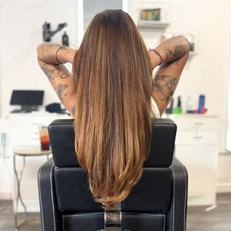 Glossy long hair styled at Salon C